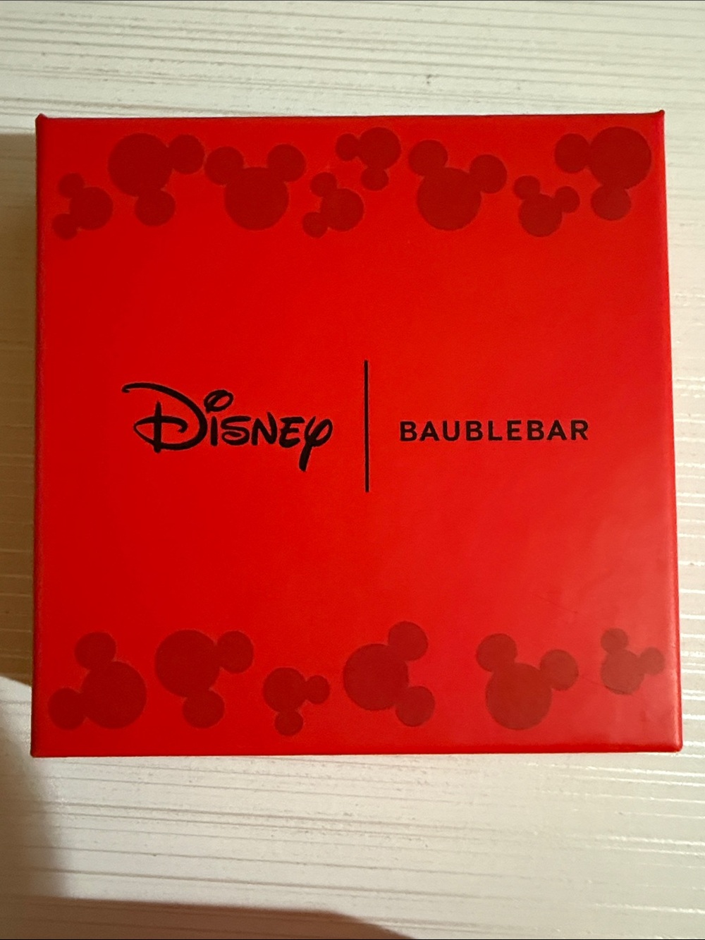 Disney x BaubleBar holiday bow earrings feature a dangling red Minnie Mouse head - Picture 3 of 4